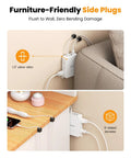Slick Flat Wall Outlet Extender With Six Versatile Side Plugs Paired With Straight Fire USBC Fast Charging flush against wall behind couch.
