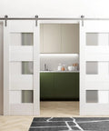 Modern Double Barn Door Kit With 13 Foot Track Rail Heavy Duty Solid Panel Interior Doors 84 By 96 Inches Installed in Room