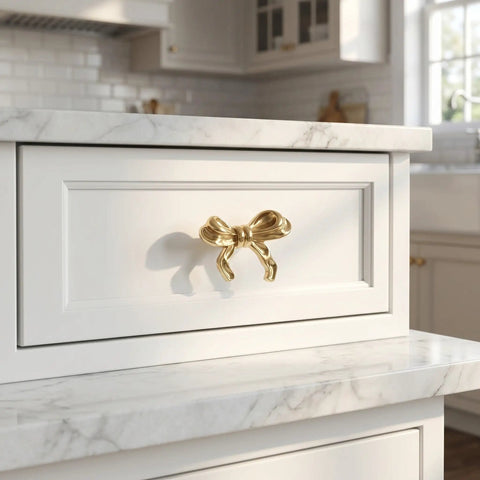 Top Shelf Vintage Bowknot Cabinet Knobs And Metal Drawer Pulls For Furniture Hardware decorative gold bowknot handle on white drawer.