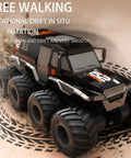 Amphibious One Twelfth Scale 8WD Remote Control Monster Truck For Land And Water Waterproof displaying 360° rotation on sand.