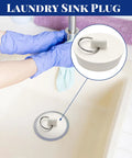 Heavy Duty Six Piece Rubber Drain Stopper Set For Bathroom Sink And Bathtub With Clearly Labeled Sizes And No Sweat Quick Swap White Zero Leak Bath Accessory, shown in use in a laundry sink.