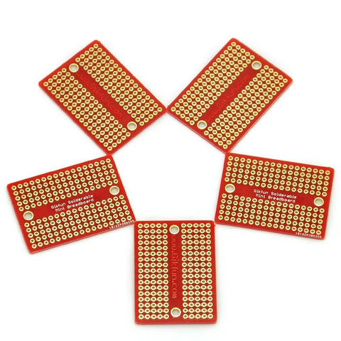 Five mini solderable breadboards with gold plated finish, proto boards for Arduino and DIY electronics 1.3 by 1.8 inch, arranged in a circle.