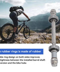 Biker on mountain trail with Must Have Front And Rear Bicycle Axle Set With Quick Release Levers, focus on durable build
