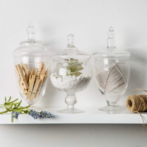Set Of 3 Clear Glass Apothecary Jars With Lids For Candy Buffets And Home Decor Tall 10 Inch And Two 9 Inch Jars On Shelf