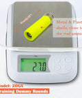 20 Gauge Safety Practice Rounds Action Trainer Dummy Snap Caps Dry Fire Training Kit on digital scale showing weight 27g