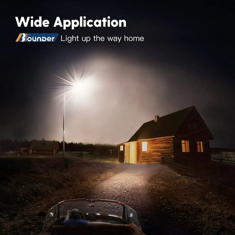 LED Outdoor Barn Light With Dusk To Dawn Sensor illuminating a rural path and house at night for security and wide coverage.