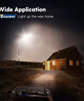 Night scene showing LED Barn Light 120W Dusk To Dawn Outdoor Flood Light With Photocell illuminating a rural house.