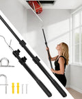Beefy Attic Pull Down System Kit With Adjustable 17 To 36 Inch Range, Y Hook And Two Handles, Heavy Duty Triangular Steel Tube shown in use with a woman accessing an attic door.