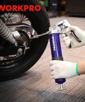 Person using Heavy Duty Grease Gun Kit With 6000 PSI Power, 18 Inch Flexible Hose, 2 Fixed Tubes, 3 Nozzles, 14 Oz Load