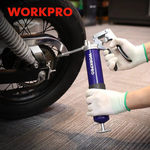 Person using Heavy Duty Grease Gun Kit With 6000 PSI Power, 18 Inch Flexible Hose, 2 Fixed Tubes, 3 Nozzles, 14 Oz Load