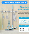 Broom and Mop Holder Wall Mount Organizer with five racks and four hooks holding cleaning tools, adhesive and screw options shown