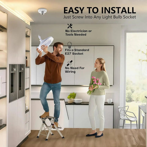 Man installing LED Light Socket Ceiling Fan With Remote in kitchen, easy screw in, no tools needed, standard socket base. Woman watching.