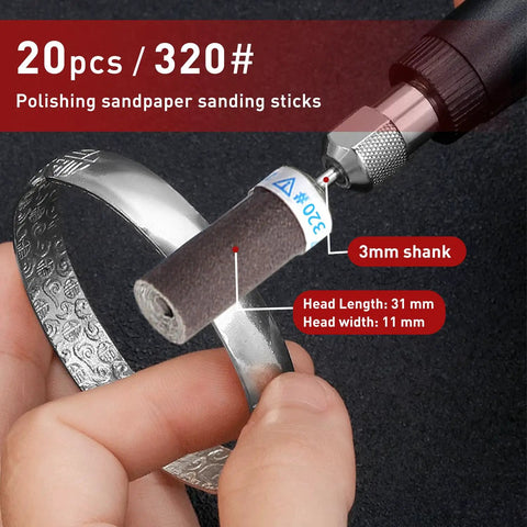 Close-up of 20Pcs 320 Grit Sanding Drums And Sandpaper Sticks Set For Rotary Tools With 1/8 Inch Shank polishing metal bangle.
