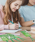 Students using Must Have 120 Pack Mental Health Awareness Bookmarks With 6 Styles, Double Sided Designs Plus 120 Green Ribbons in class.