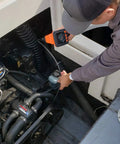Mechanic using Camera Assisted Retrieval Tool With 32 Inch Bendable Gooseneck Four Prong Claw Live 480P Video On Two Point Eight Inch LCD Four LED Lights Magnetic Tip Pulls Ferrous Objects From Tight Spaces For Contractors Mechanics And DIY Pros Orange to inspect engine area.
