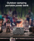 Pocket Sized Power Station With LiFePO4 Battery, 89.6Wh, 100W Continuous Output And 200W Peak on table during camping