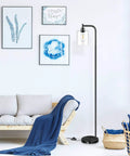 Industrial Floor Lamp With Hanging Glass Shade In Black Farmhouse Vibe, Tall Pole Light For Living Room, Bedroom Or Office, Edison E26 Base, Rustic Vintage Look, ST64 Bulb Included near modern sofa.
