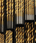 Tough As Nails 99 Piece Drill Bit Set For Steel Wood And Metal with assorted gold and silver drill bits in storage compartments.