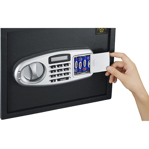Hand inserting batteries in Drop Safe For Cash Drops With Digital Keypad And Two Manual Override Keys Wall Or Floor Mounted Electronic Safe Deposit Box