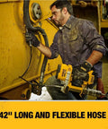Man using 20V Max Cordless Grease Gun Kit with 4.0Ah Battery and Charger LED Light 42 Inch Hose 10000 PSI on machinery