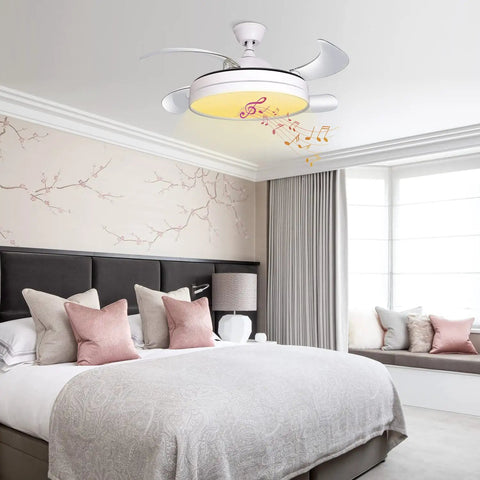 42 Inch Retractable Ceiling Fan With Lights And Bluetooth Speaker in bedroom with hidden blades, modern design.