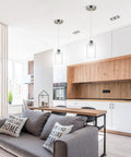 Three Pack Industrial Pendant Lights for Kitchen Island And Living Areas, over modern kitchen with clear glass shades.