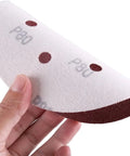 Six Inch 150 Mm Sanding Discs With Hook And Loop Aluminum Oxide Grits From 60 To 2000 For Orbital Sanders shown being held.