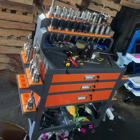Tough As Nails Heavy Duty Workbench Steel Rolling Tool Cart With Dual Lockable Drawers housing tools and accessories in a workshop.