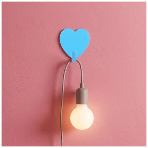 Hella Cute 10 Pack Heart Wall Hooks Super Sturdy Adhesive Mount for holding light cords on a pink wall.