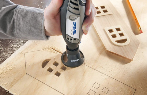 Variable Speed Corded Rotary Tool Kit used for precise wood carving with 1 attachment for engraving intricate designs on wood surface.