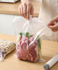 Person sealing meat in vacuum bag using 30 Piece Vacuum Storage Bags Sealing Clip Reusable Zipper Labor Saver Sliding Grip For Clothes Bedding And Food Preservation Airtight Seal Clips For Quick Access And Snack Bags Hassle Free Easy Pack And Unseal.