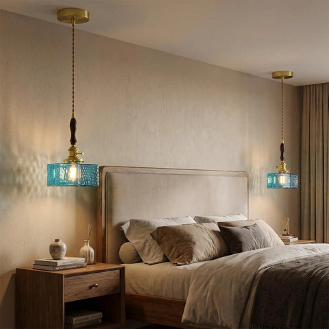BBLLWJ 1-Pack Vintage Pendant Light for Kitchen Island, Brass & Wood Hanging Fixture with 78" Adjustable Cord, Blue Rectangular Hammered Glass Ceiling Light for Dining Room, Sink, Bedroom above a bed in a cozy bedroom setting.