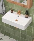 CHIKESI 24"x14" Wall Mount Sink, White Rectangular, installed in a green tiled bathroom with modern fixtures.