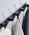 Tough As Nails Wall Mounted Coat Hooks With Slick Black Finish For Heavy Duty Closet And Bathroom Storage, holding towels.