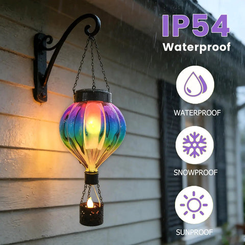 Hot Air Balloon Solar Lantern Outdoor Waterproof Hanging Glass Light With Flickering Flame Totally For Garden Backyard Patio Fence Decor Purple Gifts For Women, showing IP54 waterproof feature in rain.