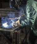 Person welding wearing Goatskin and Cowhide MIG Welder Gloves Pack of 12, Kevlar-Trimmed, Fleece-Lined, Medium, green jacket.