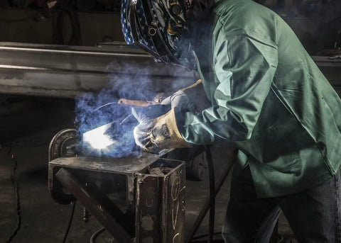 Person welding wearing Goatskin and Cowhide MIG Welder Gloves Pack of 12, Kevlar-Trimmed, Fleece-Lined, Medium, green jacket.