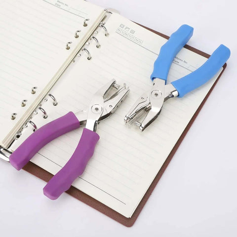 Two one quarter inch single hole punches with soft grip handles, 6 sheet capacity, on notebook pages, pack of 3, ideal for labels and cards.