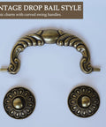 Six Pack Vintage Drop Bail Cabinet Handles In Antique Brass Finish with decorative rosettes, classic style for furniture updates.