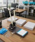 Heavy Duty Two Hole Paper Punch For Binders Metal Power Puncher with long lever on office table, 150 sheets capacity, 70mm spacing