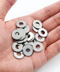 Hand holding Stainless Steel Flat Washer M6 16mm Outer Diameter 6mm Inner Diameter 1.5mm Thick 304 Stainless Steel Rustproof Hardware