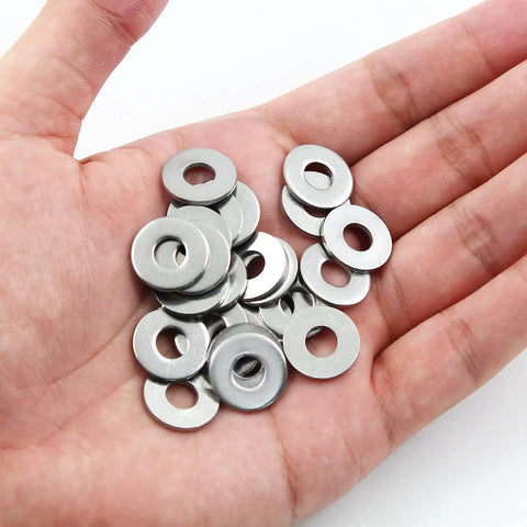 Hand holding Stainless Steel Flat Washer M6 16mm Outer Diameter 6mm Inner Diameter 1.5mm Thick 304 Stainless Steel Rustproof Hardware