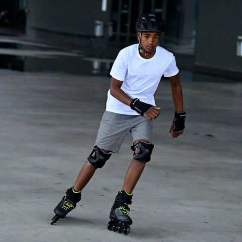 Person wearing Macroblade 80 Inline Skates For Men Casual Skating And Entry Level Training with protective gear, outdoors.