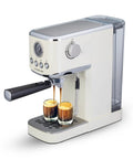 Game Changer 20 Bar Espresso Maker With Dependable Steam Wand And Silky Milk Frother brewing espresso shots in two glasses.