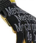 Material4X Original Work Gloves For Rugged Abrasion Resistant Hand Protection With Durable Synthetic Leather Breathable Comfort Fit Secure TPR Wrist Closure Machine Washable Brown Black Large, side view showing TPR closure and synthetic leather.