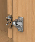 Installed satin-nickel concealed hinge for face-frame cabinet door; 1/2 inch overlay, 105° soft-close