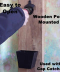 Heavy Duty Cast Iron Beer Bottle Opener Wall Mounted With Installation Screws Rock Solid Old School Design For Man Cave Bar Setup with wooden post.