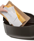 Person inserting mail into Villa Wall Mount Mailbox Large Rubbed Bronze Die Cast Aluminum with roof lift access.