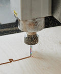 Close-up of CNC machine using Up Cut Spiral Router Bit Set, 3 Flutes, 1/8 Inch Cutting Diameter on wood surface