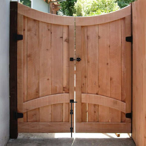 Wooden gate with 24 Inch Cane Bolt Drop Rod Gate Hardware Heavy Duty Black Solid Steel Ground Latch For stability and security